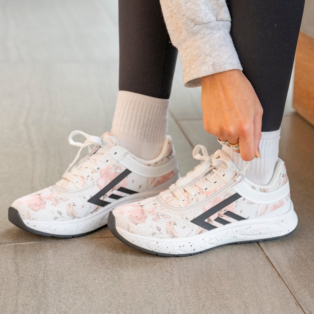 women's expresso mid tops in foreground with ocean in background